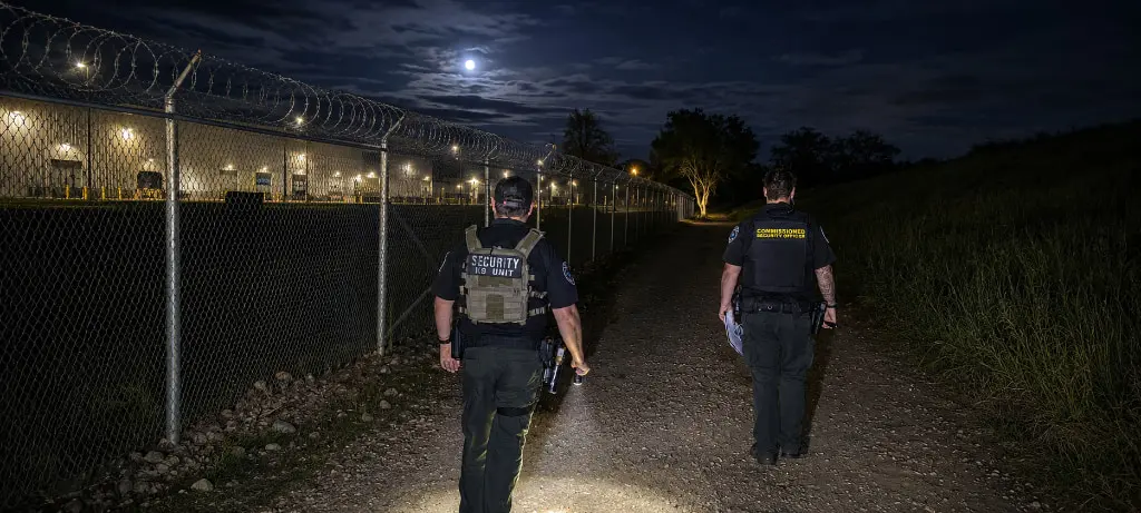 GPI officers conducting a nighttime perimeter patrol with a patrol vehicle, Global Protection & Investigations PPO# 120206